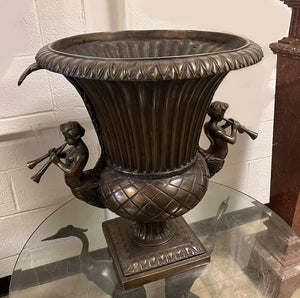 Bronze Fluted Urn with Two Angels Blowing Horns