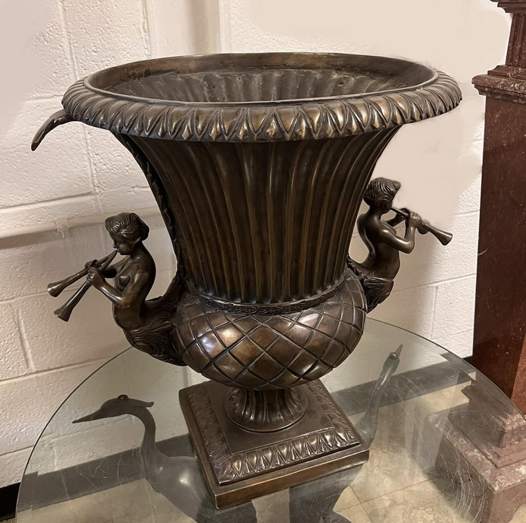 Bronze Fluted Urn with Two Angels Blowing Horns
