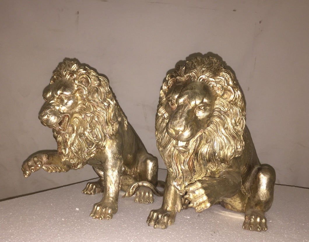 Bronze Lion Sculptures Showing Paws