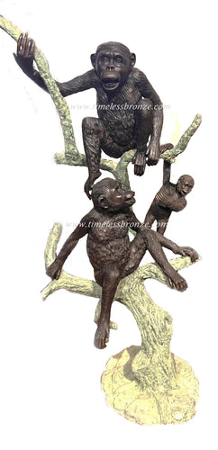 Bronze Monkeys Statues on a Tree