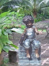 Bronze Toddler Boy Sitting on Wall Statue