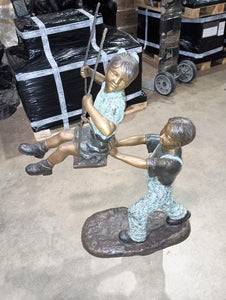 Boy Pushing Girl on Swing Bronze Sculpture