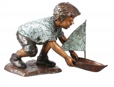 Boy with Sailing Boat Sculpture