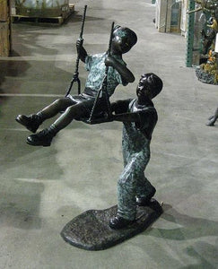 Boy Pushing Girl on Swing Statue